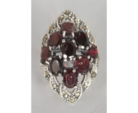 A LARGE RUBY AND MARCASITE DRESS RING.