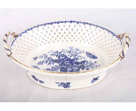 A Worcester oval two-handled chestnut basket, sides pierced lozenge design, base decorated pine cones and butterflies, open c