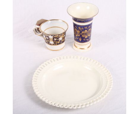 An early Spode creamware osier plate, 7" dia, a Derby gilt decorated spill vase (restored) and a cabinet cup