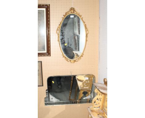 An Art Deco frameless wall mirror and an oval gilt framed wall mirror