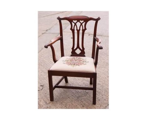 A Chippendale design mahogany carver chair with Gothic pierced central splat and drop-in floral tapestry seat, on square supp