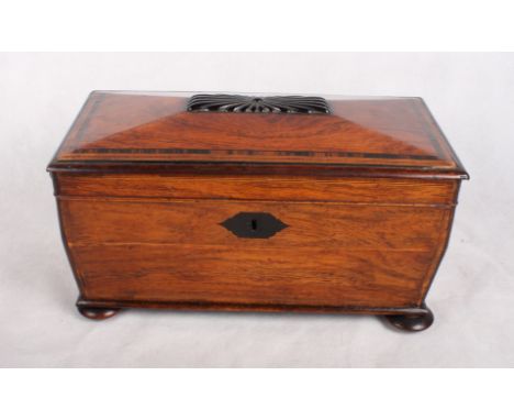 An early 19th Century rosewood two-compartment tea caddy with glass mixing bowl, on bun feet, 12" wide (wooden ring handles m