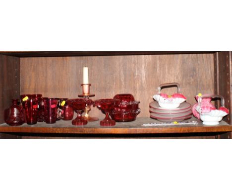 A pair of ruby glass pedestal vases with turn over rims, a Venetian gilt decorated candlestick, two ruby glass bowls, a set o