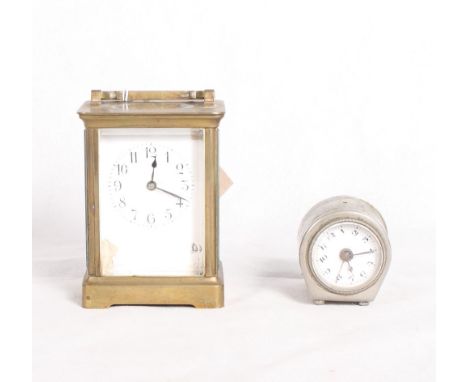 A brass framed carriage clock with white enamelled dial (damaged) and a bedroom clock in plated case