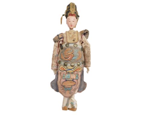 A 19thC Chinese opera doll, with a composite body, silk hat and tunic, embroidered in silk and wire work with a dragon's head