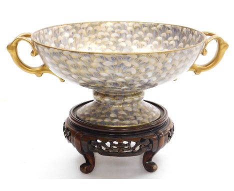 A Japanese porcelain comport, possibly Noritake, of gilt, twin handle form, decorated all over in blue and gilt with a spread