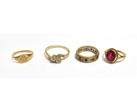 AN ASSORTMENT OF LADIES DRESS RINGS  One oval mixed cut synthetic ruby set in 9ct yellow gold, ring size K 1/2.  An illusion 