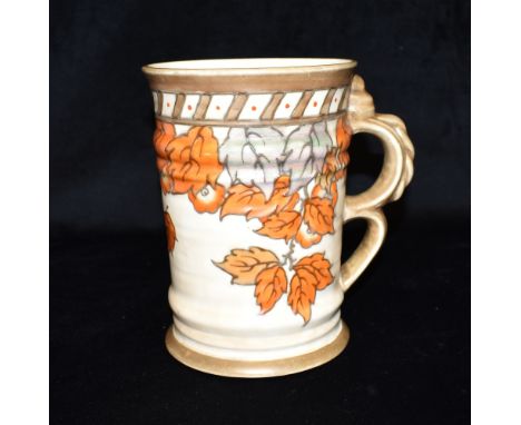 CHARLOTTE RHEAD FOR CROWN DUCAL:  a tankard with double loop handle, shape 198, painted in 'autumn Leaves' pattern 4921, 19cm