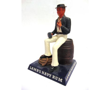 [ADVERTISING]. A LAMB'S NAVY RUM RETAILER'S PAINTED PLASTIC COUNTER-TOP FIGURE  in the form of a Nelson-era sailor seated on 