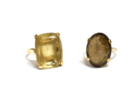 TWO QUARTZ DRESS RINGS One flat claw set cushion cut citrine, approx 17.9 x 14.2mm, on 14ct gold band. Size N 1/2. One sugar 