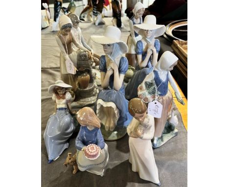 A GROUP OF NINE NAO FIGURES:  model 136 Girl at the Fountain(x2), model 229 Girl with Straw Hat, and five others (9) Conditio