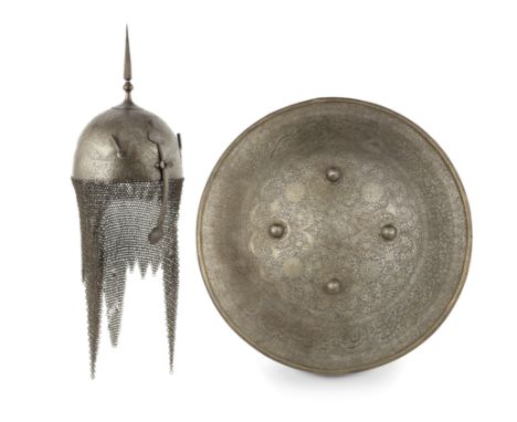 A Qajar gold damascened steel Helmet and Shield Persia, 19th Centurythe helmet of domed form surmounted by a spike, the front