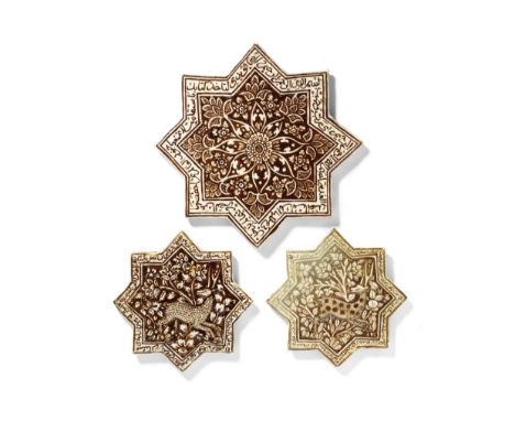 Three Qajar 'Kashan style' lustre pottery star tiles Persia, 19th Centuryeach with eight points, decorated in brownish gold l
