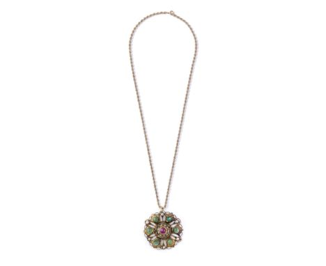 A gem-set enamelled gold circular pendant (tazra) Morocco, 19th Centuryin the form of a flowerhead, the petals in the form of