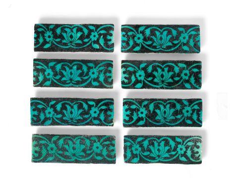 A group of Timurid underglaze-painted pottery border tiles Persia, 15th Centuryeach of rectangular form, decorated in black u
