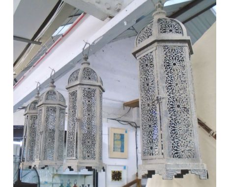STORM LANTERNS, a set of four, Moorish style, in a vintage grey metal, 23cm x 66cm. (4)