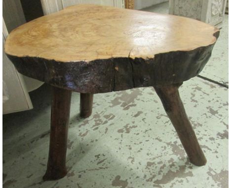 RUSTIC OCCASIONAL TABLE, elm trunk section, splay supports, 65cm x 55cm H.