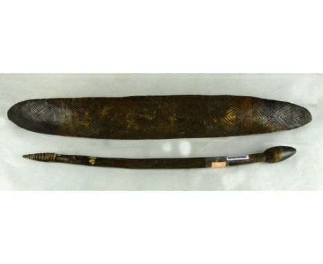 A Parrying Shield & Parrying Stick:
Australian Aboriginal, the shield of swollen navette form with incised line bands & geome