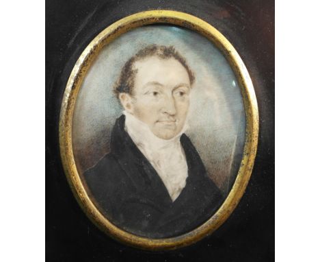 English School (19th century):
A portrait miniature of a gentleman in a dark jacket & white cravat, dated 1823 & inscribed ve