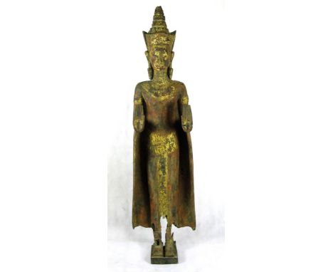 A South-East Asian wooden figure
Representing a Khmer style standing Buddha with hands in double abhaya mudra. With traces of