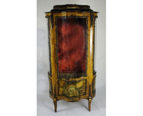 A French kingwood and metal mounted display cabinet, circa 1900:
With shaped door to trunk flanked by side doors, the glazed 