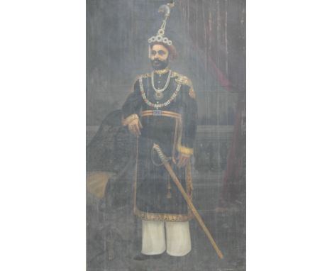 Anglo-Indian School (19th/20th century):
A full length, life size portrait of a Maharaja in an interior, in full princely att