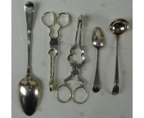 Two pairs of Georgian silver sugar nips, Old English pattern dessert spoon, teaspoon and a bead pattern ladle