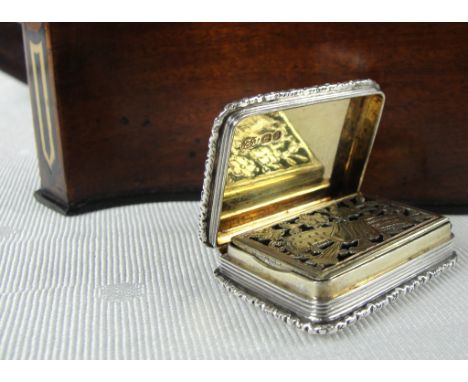 A Good Early Victorian Silver Vinaigrette of Oblong Form:
with engine turned decoration to the base and lid, raised foliate b