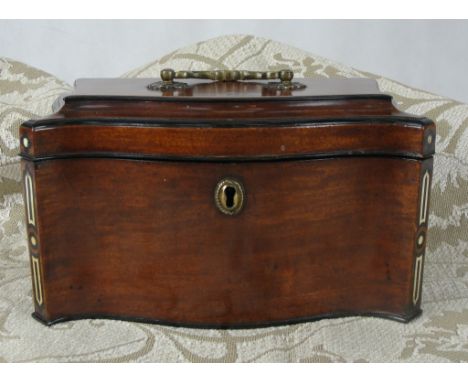 A good early George III serpentine inlaid tea-caddy: 
The interior fitted with three compartments, the hinged lid with brass 