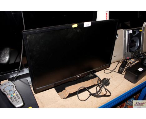 A Polaroid flat-screen tv with remote