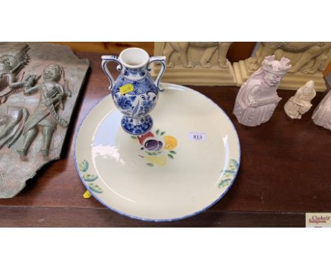 A Poole pottery plate; and a delftware vase