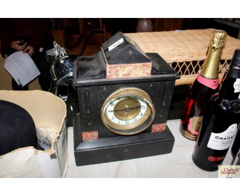 A late Victorian black slate and marble mantel clock