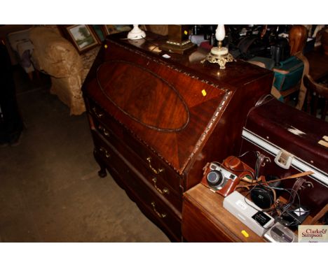 A bureau fitted three drawers