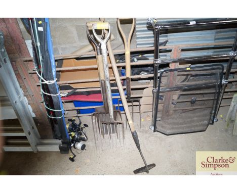 A quantity of gardening tools to include forks; shovels etc