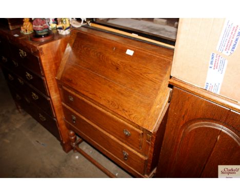 An oak bureau fitted two drawers