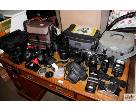 A quantity of various cameras to include Miranda; Pentax and camera lenses etc