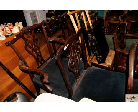 A George III Chippendale style elbow chair and similar standard chair