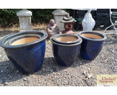 A quantity of blue ceramic garden planters 