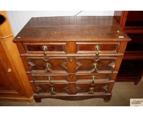 A Jacobean geometric chest raised on later feet fitted two short over three long drawers AF