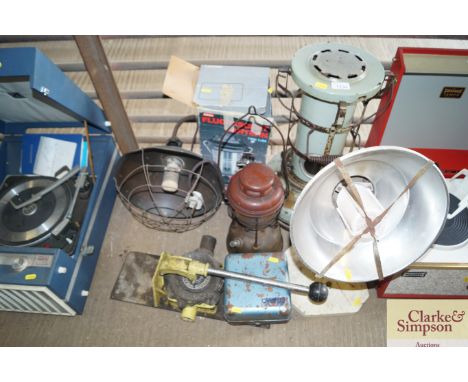 A paraffin heater; a tilly lamp; vintage heaters etc