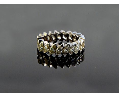 A diamond set full eternity ring, mounted with twenty-one marquise shaped diamonds, in a slanting design, total weight approx