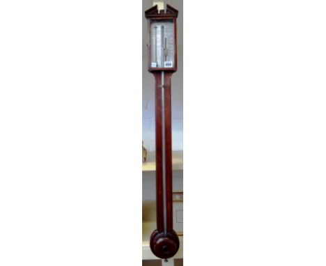 A mahogany stick barometer by J.Ortelly, 94 Holl Hill London, with broken arch pediment, silvered plate, pinched waist and ha