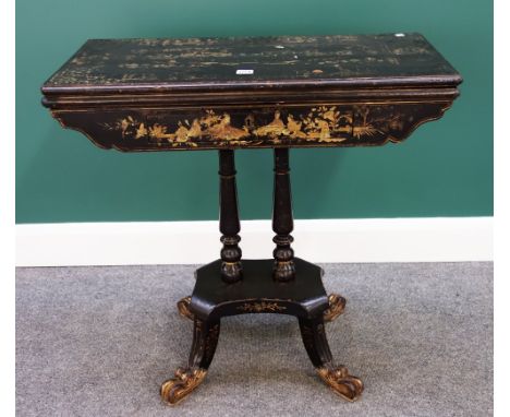 A 19th century Chinese black lacquer chinoiserie decorated card table, with single frieze drawer on turned columns, quatrefoi