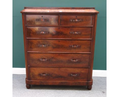 A 19th century mahogany chest, the caddy top over two short and four long graduated drawers, each with carved ribbon handles,