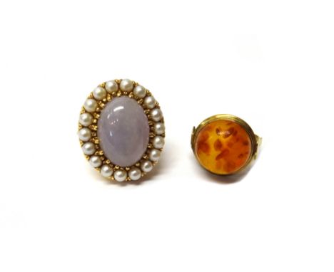 A gold, lavender coloured jade and cultured pearl set ring, claw set with the oval lavender coloured jade at the centre withi