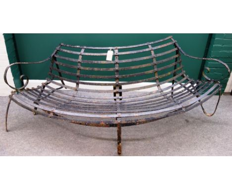 A late 19th century black painted semi-elliptic wrought iron bench, 220cm wide.