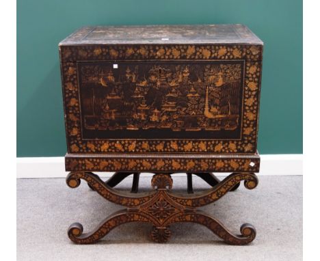 A 19th century black lacquer Chinese decorated rectangular trunk on 'X' frame stand, 95cm wide. 