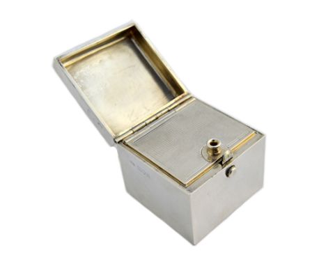 A rare silver table vesta box of plain square form, with push button and sprung hinge lid opening to reveal a drop-in hinged 