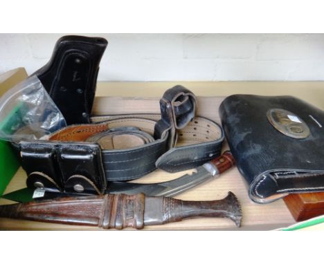 A black leather belt and holster, a leather ammunition case, a mahogany pistol case, a kukri an African dagger and a 'U.S' le