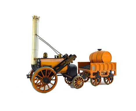 A Hornby 'Stephenson's Rocket' live steam engine and tender, with yellow livery, 40cm wide.  Illustrated

